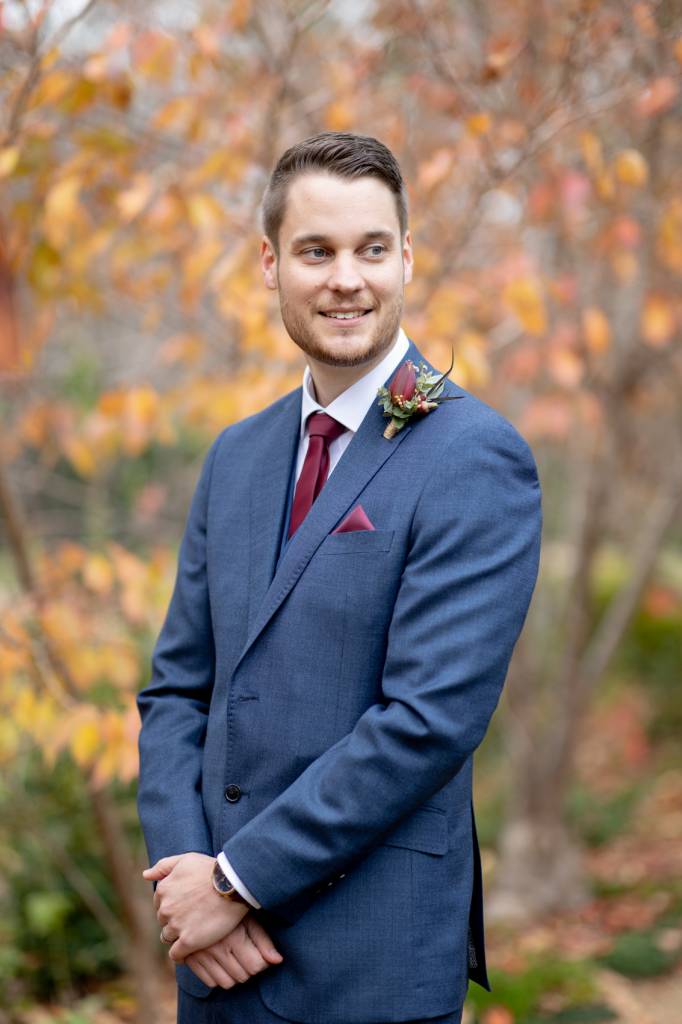 Tiny bouquets in brides' and grooms' wedding attire