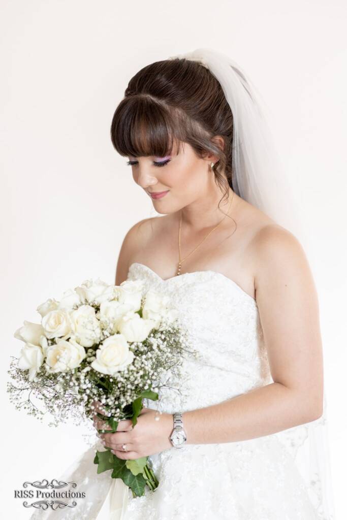 The Downward-Look Bridal Pose with Bouquet 