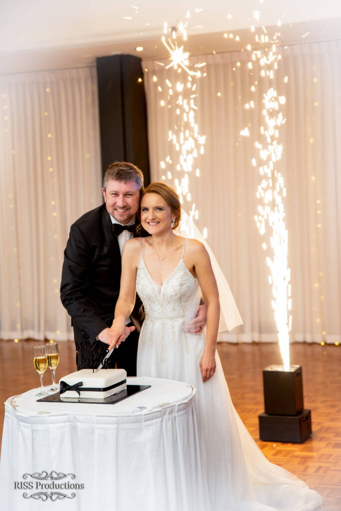 Cradle Her Waist as You Cut the First Cake of Your Shared Life Together 