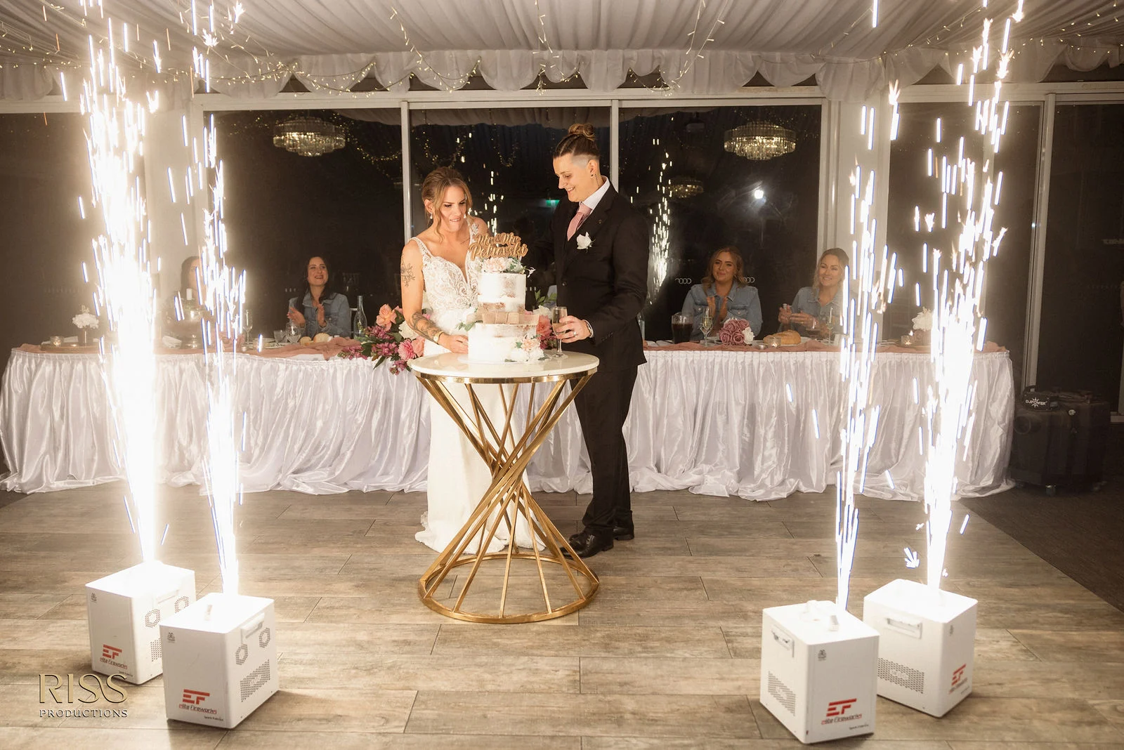 Austin and Jessica with cold sparklers at their reception at Panorama House