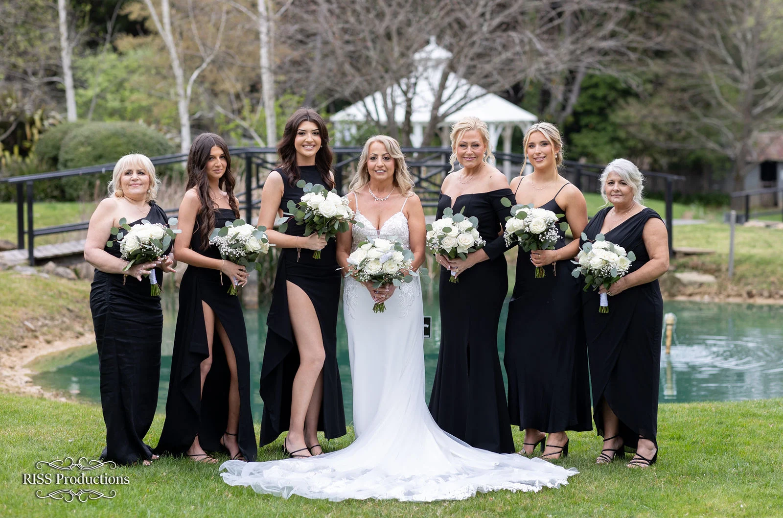 Bride with her bridesmaids in the gardens of Fitzroy Inn, Mittagong