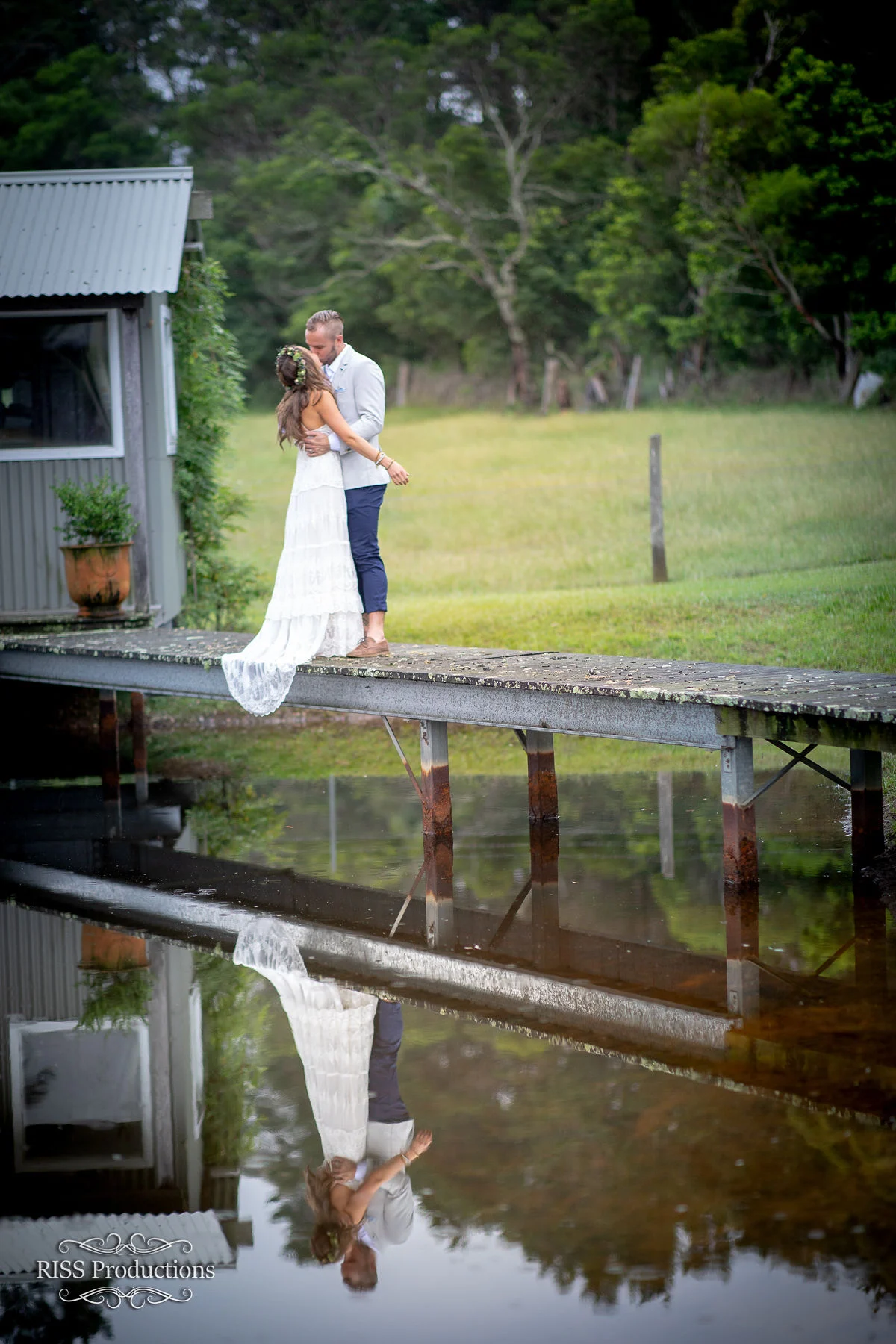 Bride beside a garden pond and cottage in the Blue Mountains