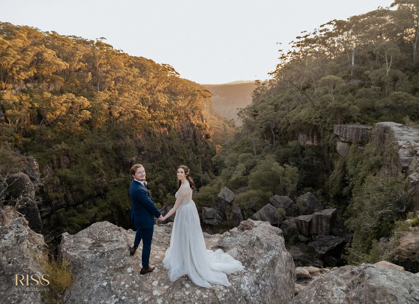 Caitlin and Jakub on a rocky clifftop in the Southern Highlands