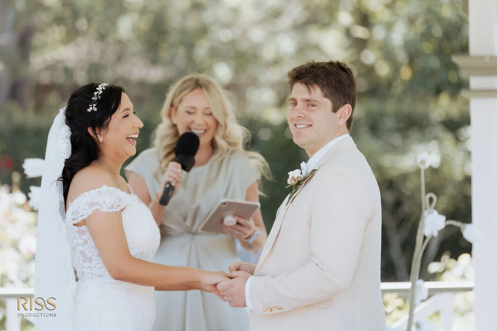 Belinda and David laughing during their ceremony at Wollongong Botanic Gardens