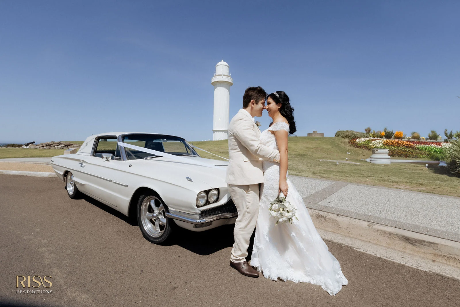 Belinda and David with a classic car near the Wollongong lighthouse