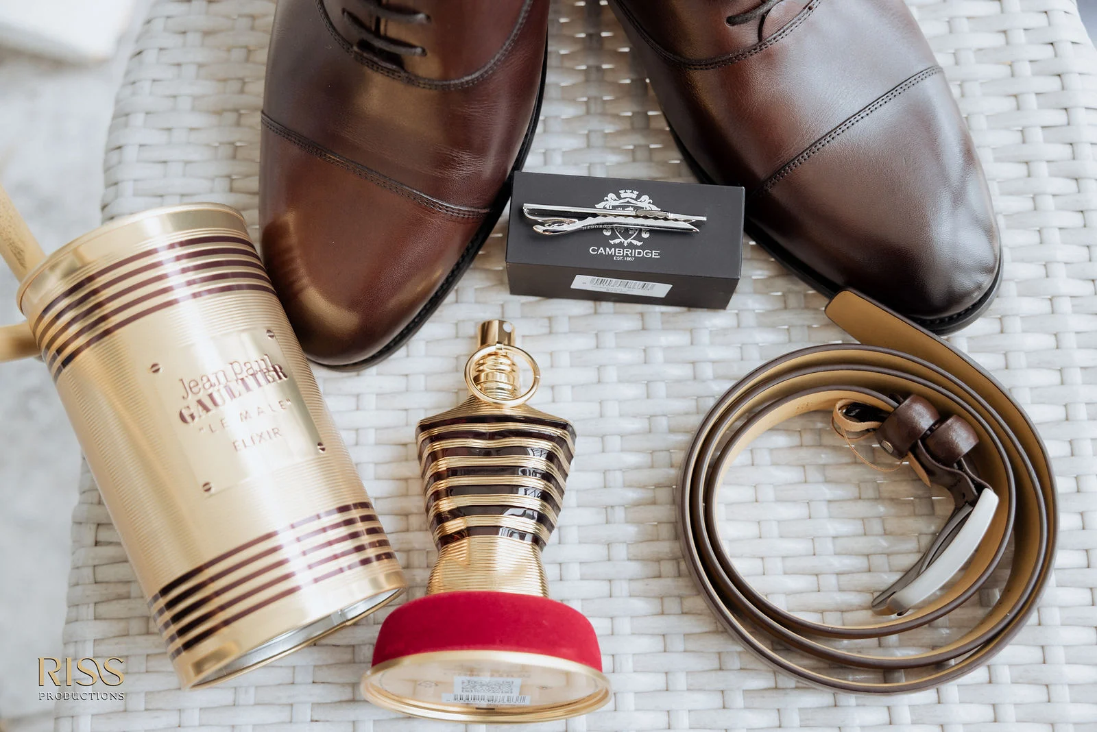 Groom's wedding day details with shoes, cologne and accessories