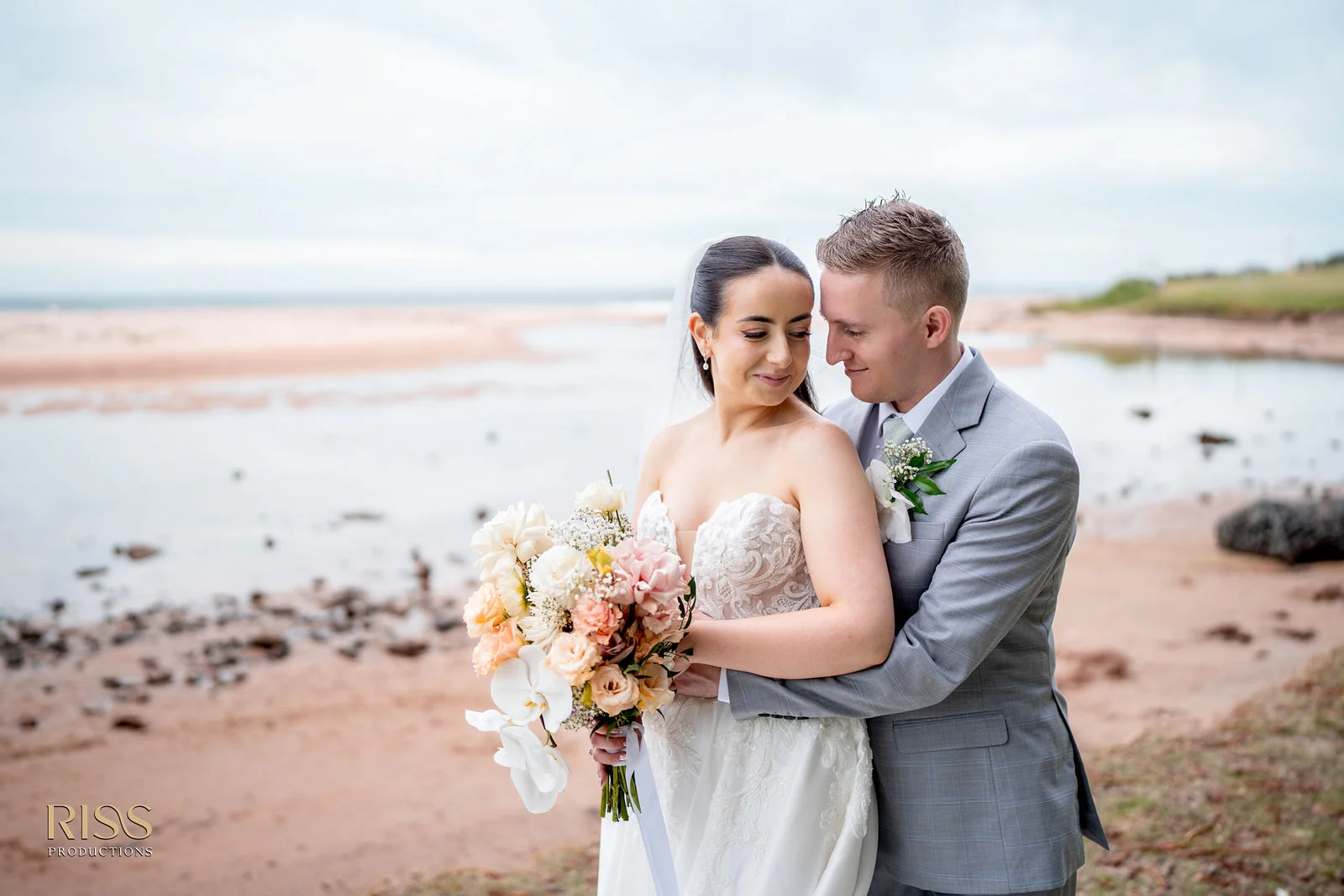 Meghan and Lachlan relaxed couple portrait by the water in Wollongong