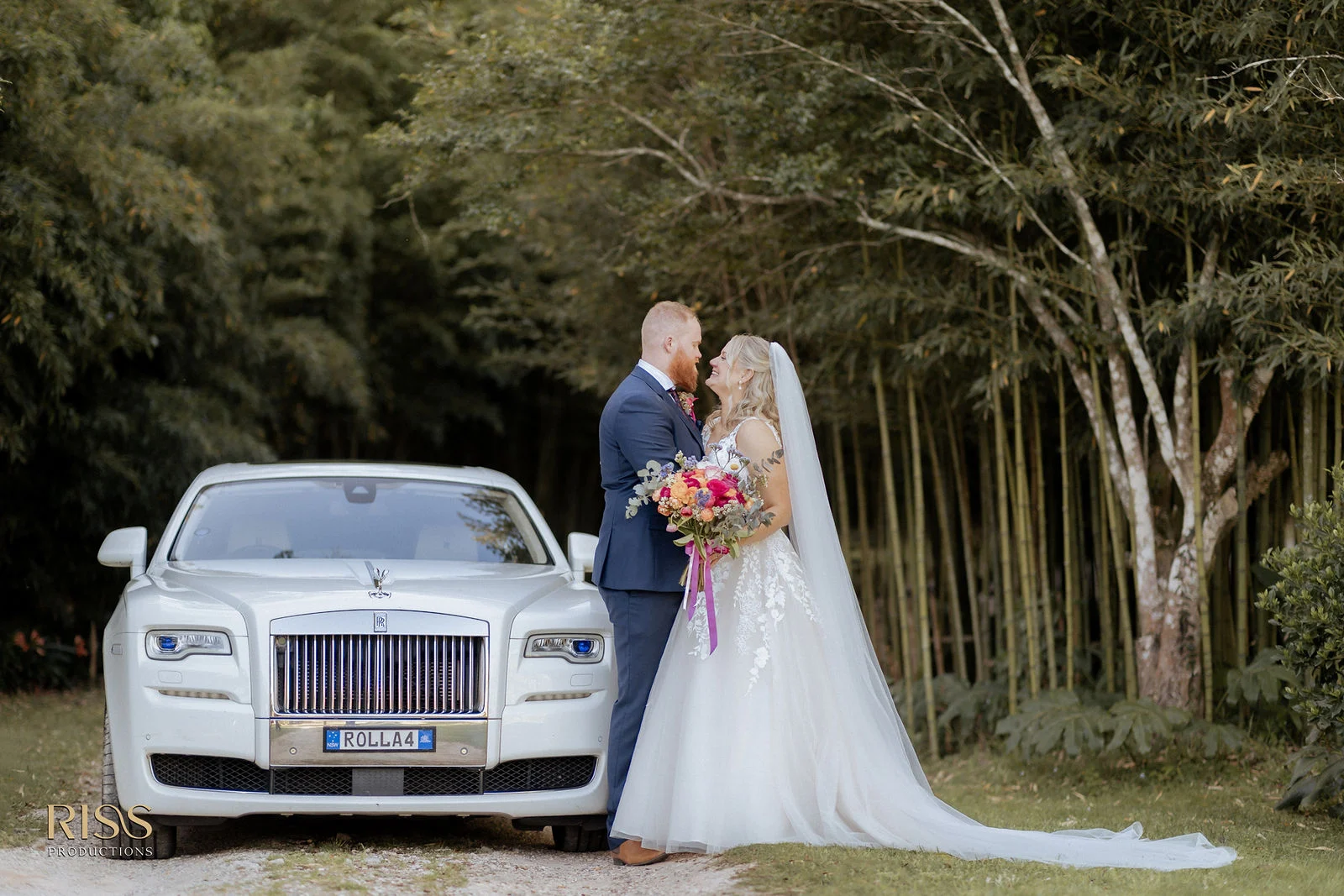 Tamara and Callan with a classic Rolls-Royce wedding car at The Linton